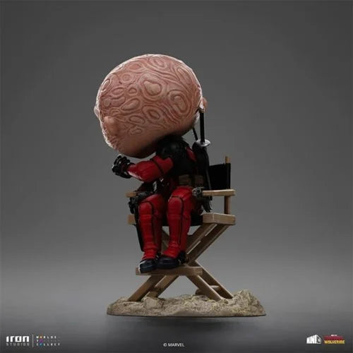 Themed display base of Deadpool Unmasked MiniCo Vinyl Figure by Iron Studios